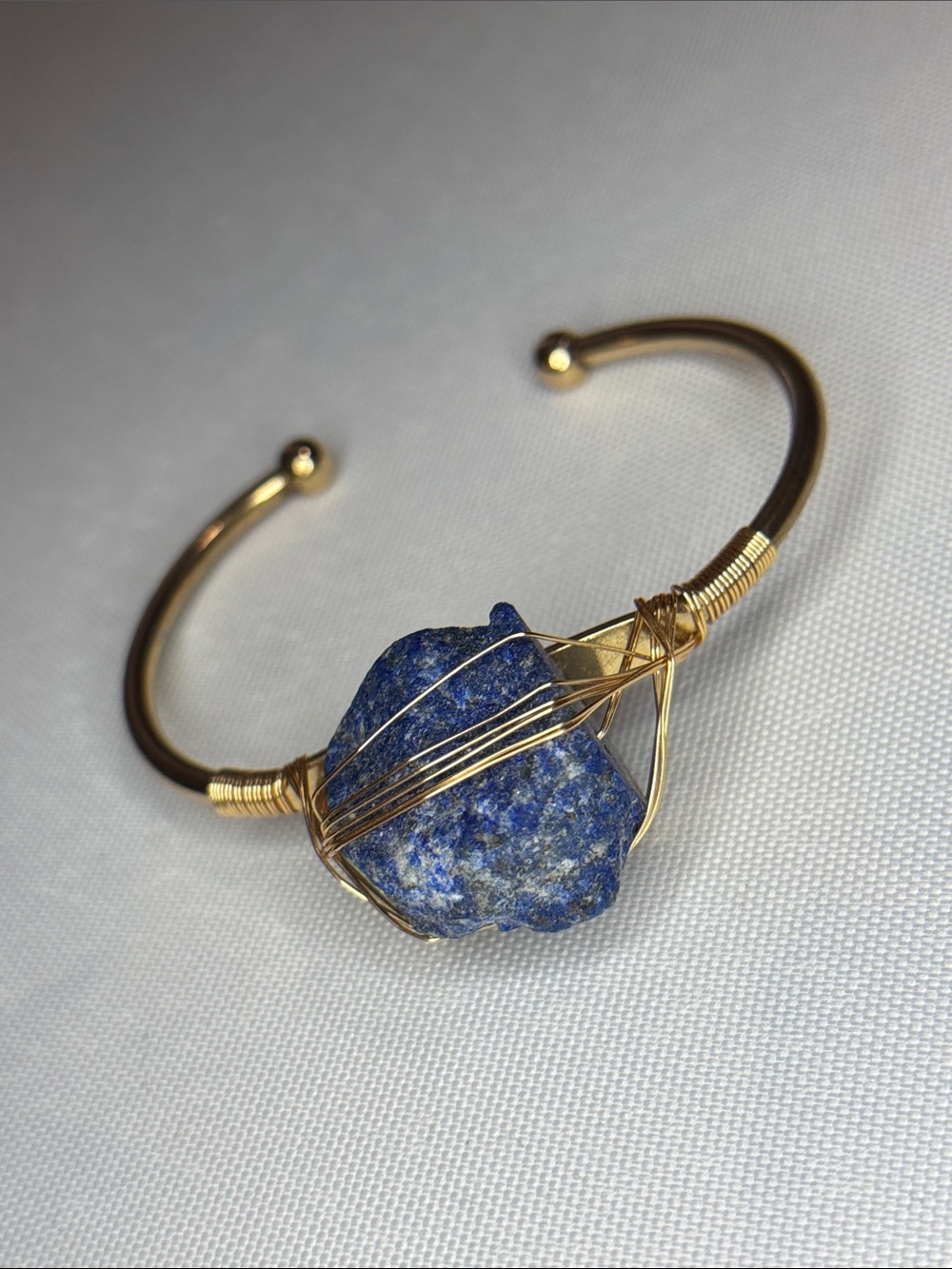 lapis lazuli, gold tone wire wrapped cuff bracelet